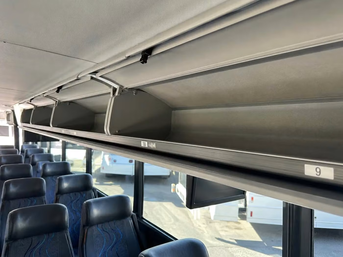 brownsburg 56 passenger charter bus overhead storage